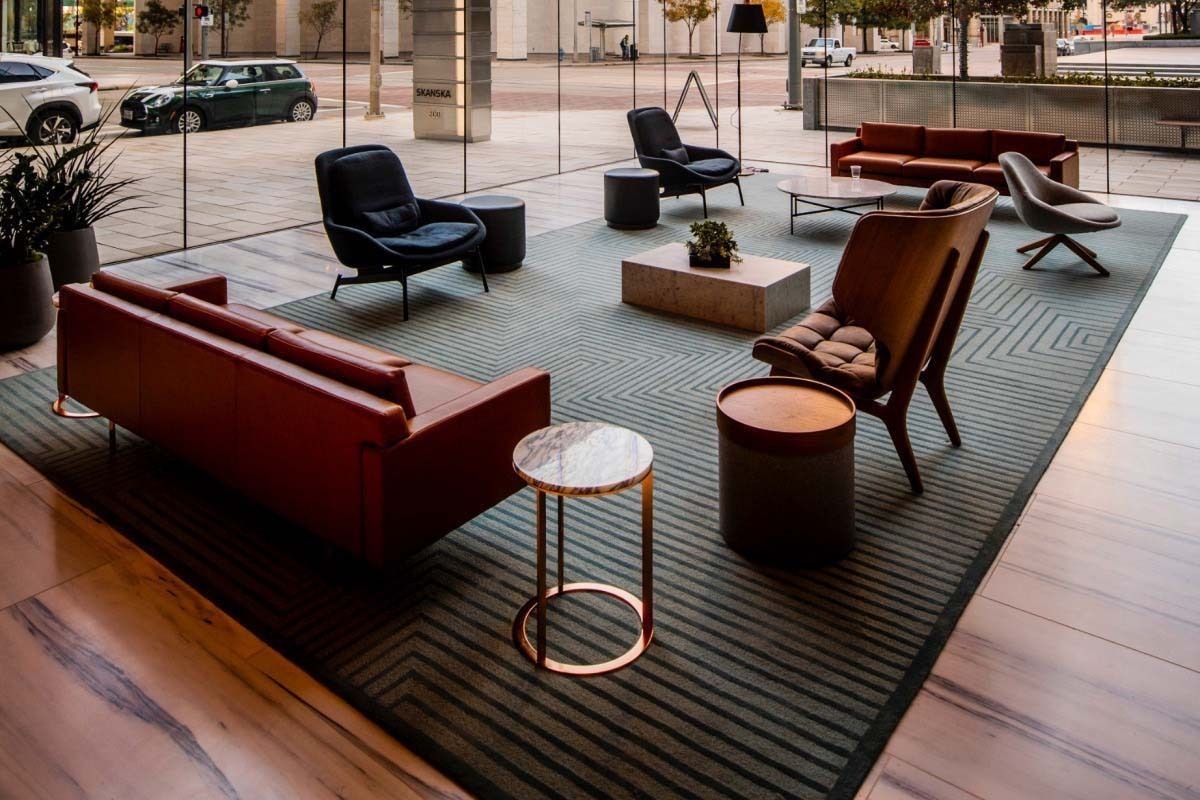 lobby with furniture items such as chairs, couches, and end tables